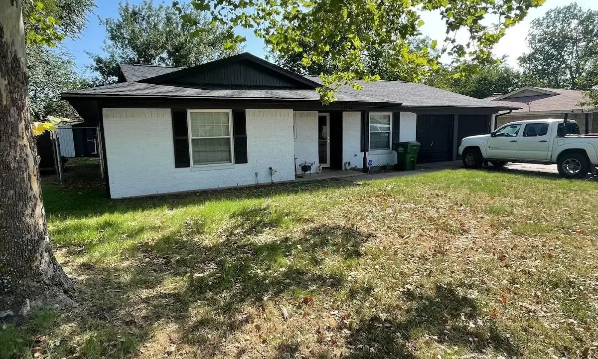 Professional roofing crew working on a residential roof in Cottonwood